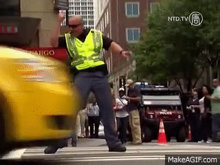 a man in a yellow vest is standing in front of a car that says argo