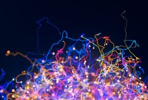 a bunch of colorful lights against a dark blue background