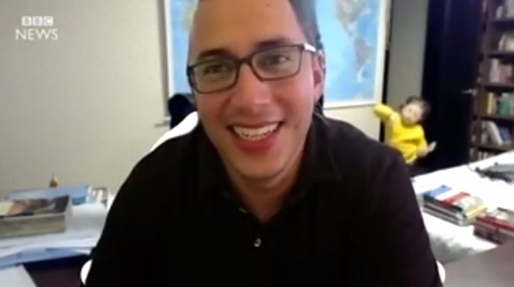 ben goldstein is smiling in front of a bbc news logo