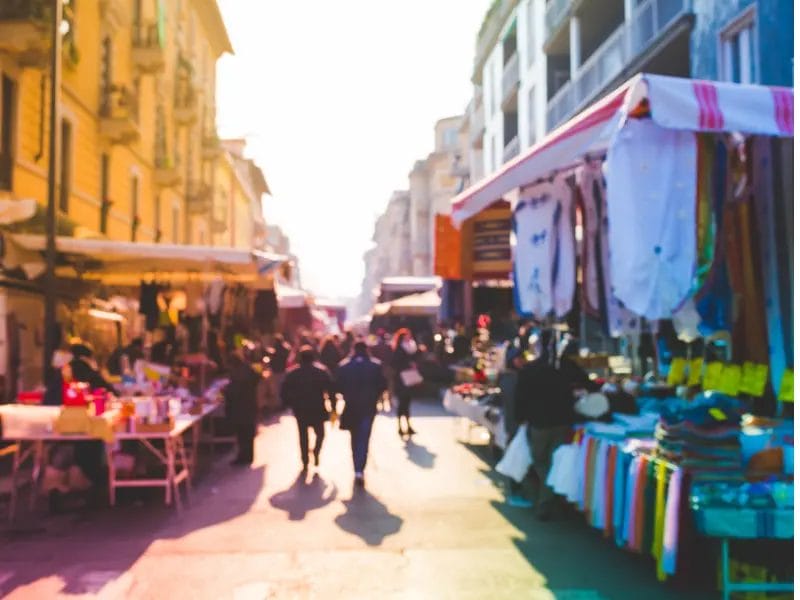 a blurry picture of people walking down a street
