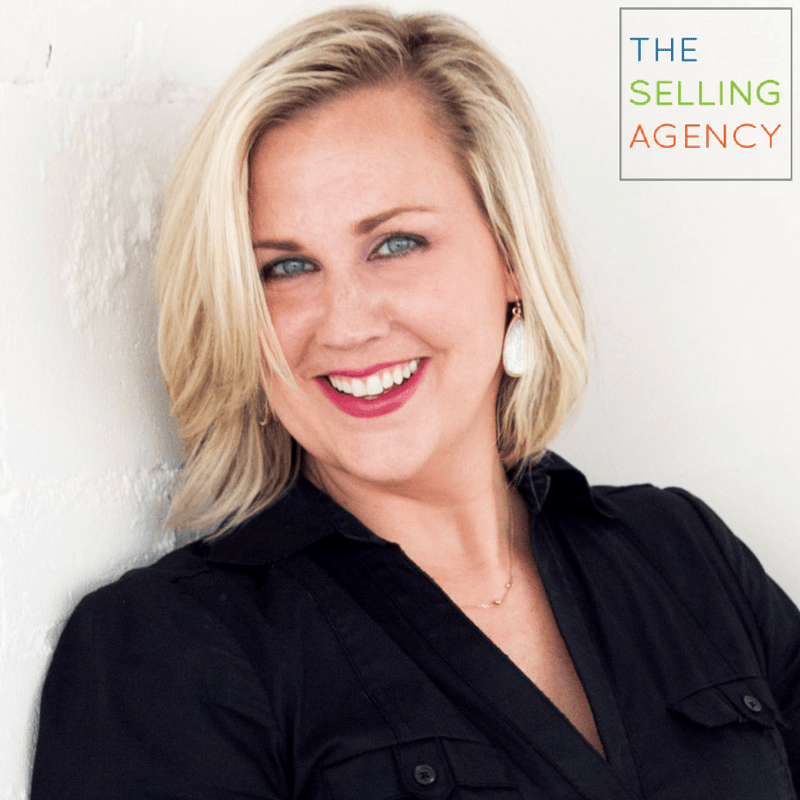 Shawn Karol Sandy smiling with the logo of the selling agency