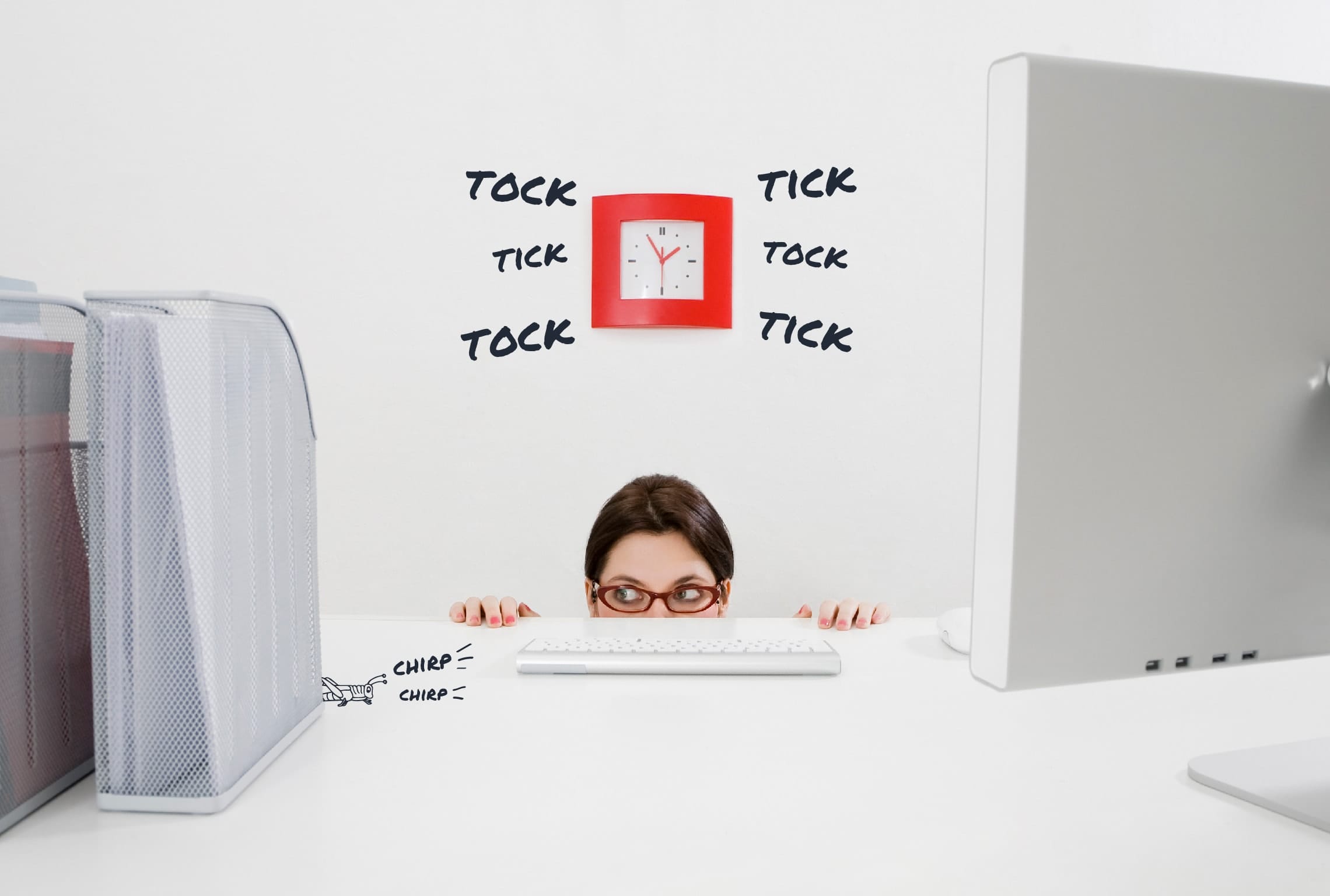 a woman peeking over a desk with a clock that says tick tock around it