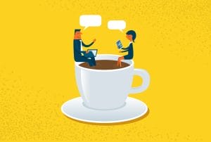 a man and a woman are sitting in a cup of coffee