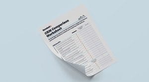 a sheet of paper with a CRM comparison worksheet on it .