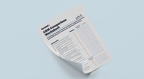a sheet of paper with a CRM comparison worksheet on it .
