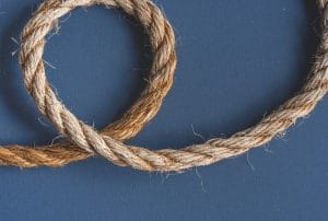 a rope is curled on a blue surface