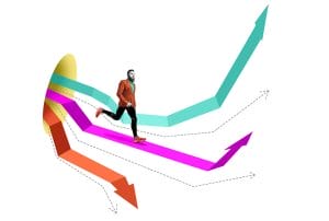 a man in an orange jacket is running on a colorful arrow out of a pipe