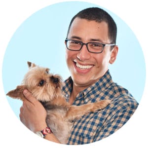 ben goldstein is holding a small dog in his arms