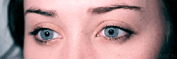 a closeup of a woman's blue eyes