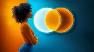 a person looking at 2 circles overlapping each other on a wall