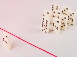 a row of dominoes with a red line between them