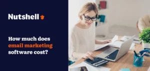 A person working at a laptop, typing on a calculator, with the words: How much does email marketing software cost?