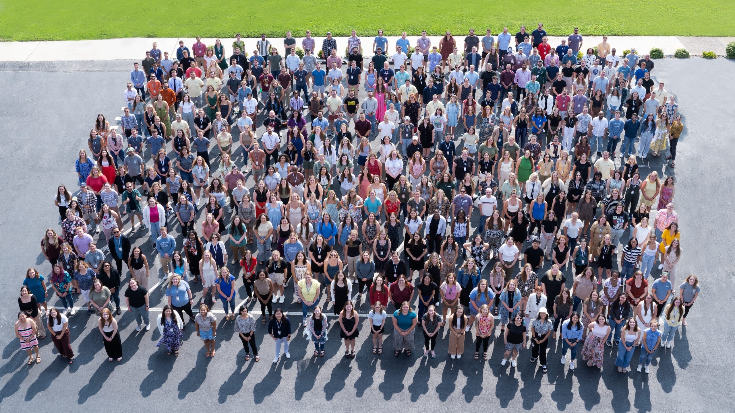 Nutshell members standing in a parking lot