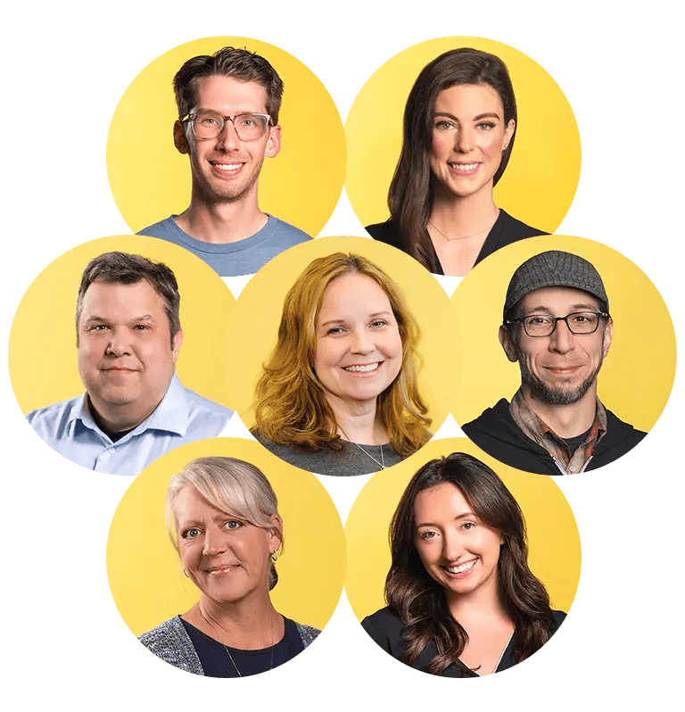 ryhmä Nutshell työntekijöitä poseeraa kuvaa varten keltaisella pohjalla.