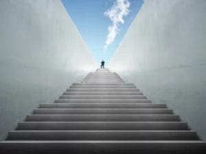 a man stands on top of a set of stairs