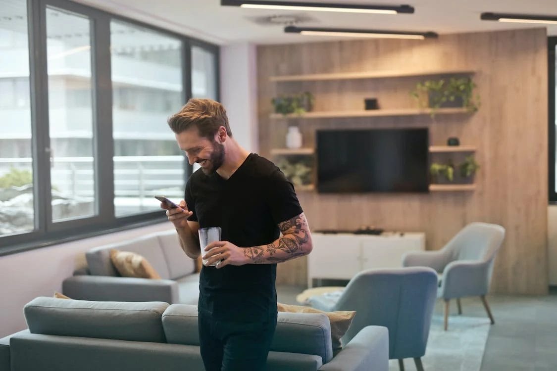 man texting in office