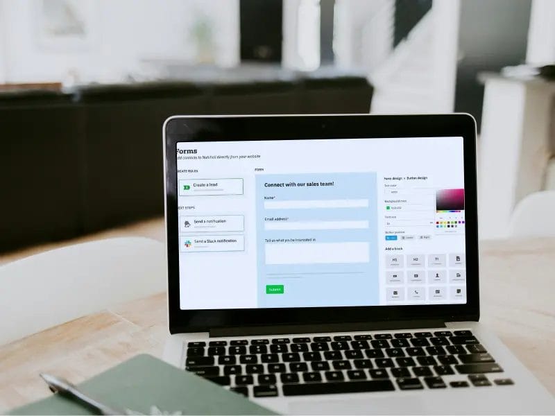 a laptop computer is open to a website on a table .