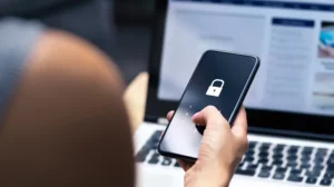 a person holding a phone with a lock symbol